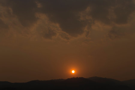 view of cloudscape and sunset on mountain hill