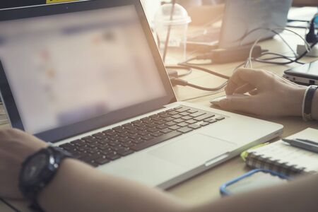 man's hand using laptop computer notebook, vintage toneの写真素材