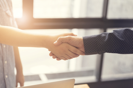 businessman handshaking for business cooperation and acquisiton concept, selective focus and vintage toneの写真素材