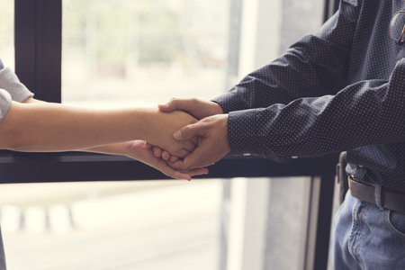 businessman handshaking for business cooperation and acquisiton concept, selective focus and vintage toneの写真素材