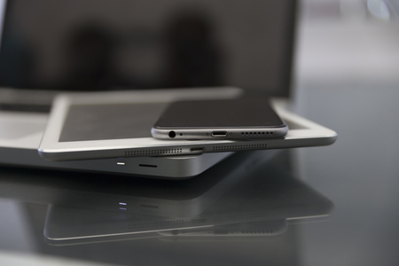 laptop computer, digital tablet and mobile phone on black table for working conceptの写真素材