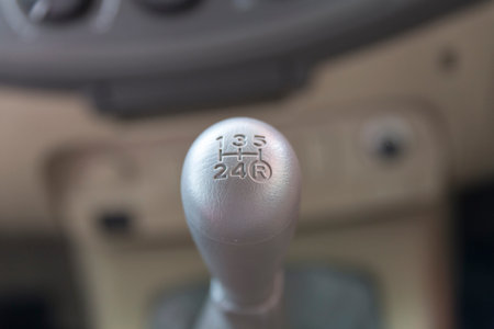 manual gearstick inside of new car automobile