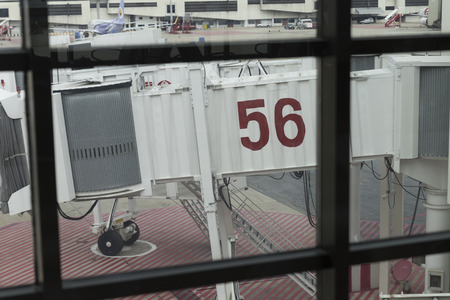 Bangkok, Thailand - May 16, 2016: jetway at airplane parking in Don Mueang International Airport in Bangkok, Thailand on May 16, 2016.の写真素材