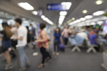 people in interior airport terminal building, blur backgroundの写真素材