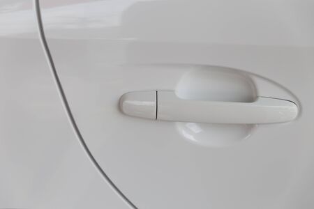 door handle of new white carの写真素材