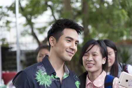 Chiang Mai, Thailand - May 21, 2016: Thanawat Wattanaputi or Pope, famous Thai actor, taking photo with his fan club at Toyota street fun festival in Chiang Mai, Thailand on May 21, 2016.のeditorial素材