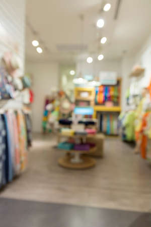 clothing selling in department store for use as shopping concept, blur background with bokeh lightの写真素材