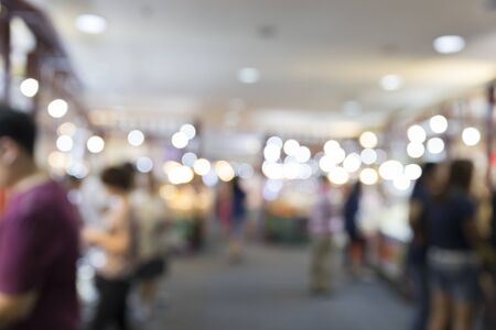 people in department store for use as shopping concept, blur background with bokeh lightの写真素材