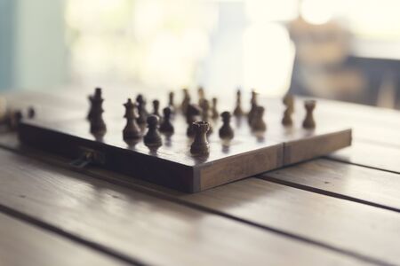 pawn of chess game on wooden table, vintage tone and selected focusの写真素材