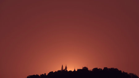 view of asian buddhist pagoda on mountain during sunset