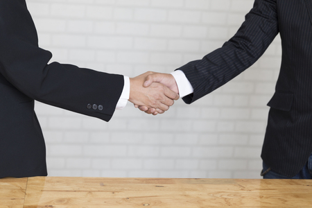 two businessman shaking hands - business teamwork, cooperation conceptの写真素材