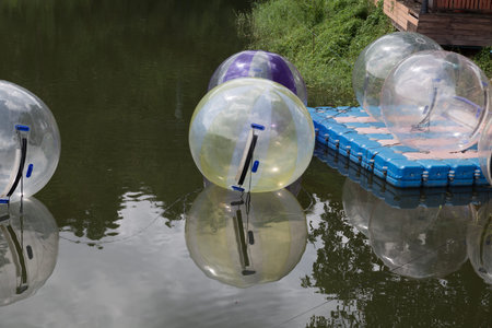 inflatable transparent ball in pond - adventure activity