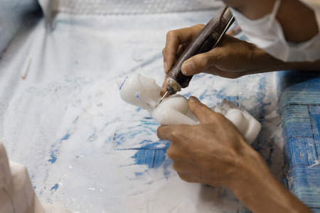 Chiang Mai, Thailand - September 18, 2016:  artisan carve and sculpture buddha image statue in unseen lanna expo 2016 held at Chiang Mai International Exhibition and Convention Centre in Chiang Mai, Thailand on September 18, 2016.のeditorial素材