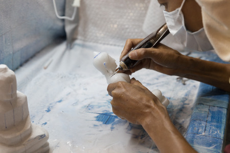 Chiang Mai, Thailand - September 18, 2016:  artisan carve and sculpture buddha image statue in unseen lanna expo 2016 held at Chiang Mai International Exhibition and Convention Centre in Chiang Mai, Thailand on September 18, 2016.のeditorial素材