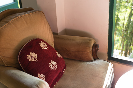 brown chair in living room near window with garden viewの写真素材