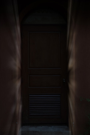 light ray through closed old wood door, gate, doorwayの写真素材