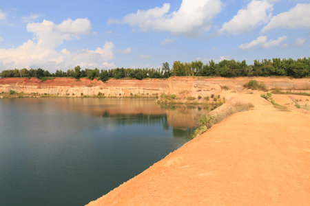 landscape view of orange valley hill and water pond lake
