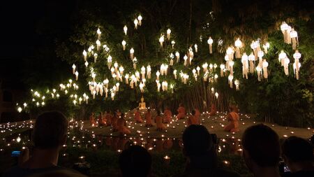 Chiang Mai, Thailand - November 14, 2016: buddhist monk pray at buddha statue in Yeepeng festival at Puntao temple in Chiang Mai, Thailand on November 14, 2016.のeditorial素材