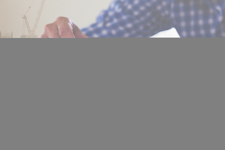 Planning, risk and strategy of project management in architect and engineer man gambling placing woon block on a tower, double exposure with crane and building under constructionの写真素材