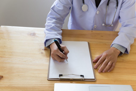 Doctor working in hospital writing RX prescription, Healthcare and medical concept, stethoscope with clipboard, selective focusの写真素材