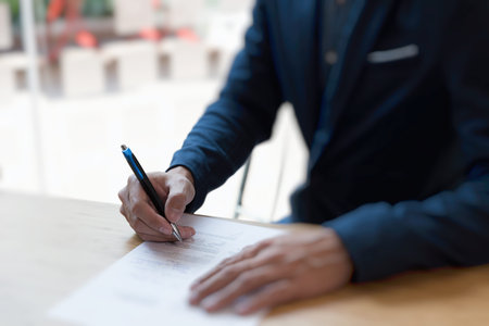 Businessman sign contract. Manager signing paper document at work. Starting partnership at...