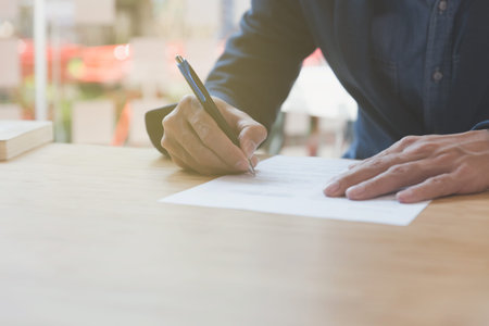 Businessman sign contract. Manager signing paper document at work. Starting partnership at...