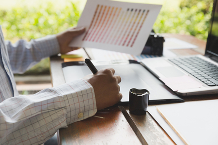 freelance artist graphic designer using digital tablet, computer, creative man working with color swatch palette catalog samples for selection - Creativity Editor Ideas Designer Conceptの写真素材