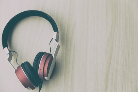 Wood office desk with headset headphone, top veiw with copy spaceの写真素材