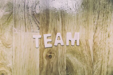 Word team from wood letters on wooden table - business conceptの写真素材
