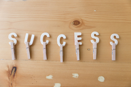 Word success from wood letters on wooden table - business conceptの写真素材