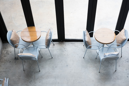 table and chair in food court, cafe, coffee shop, cafeteria, restaurant interior, top viewの写真素材
