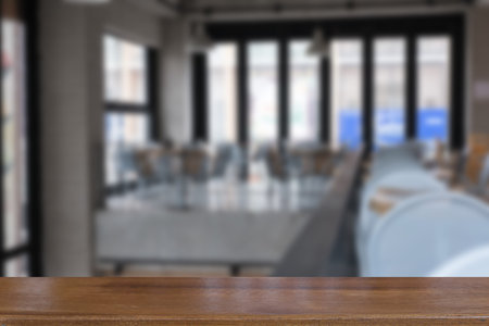 table and chair in food court, cafe, coffee shop, cafeteria, restaurant interior with wood table for...