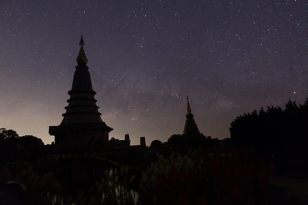 milky way with two pagoda in Doi Inthanon mountain, natural astronomy landscape (The Great Holy Relics Pagoda named Nabhamethanidol and Nabhapolbhumisiri), Chiang Mai, Thailand.の写真素材