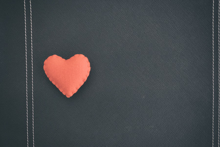 red heart on black book. love backdrop backgroundの写真素材