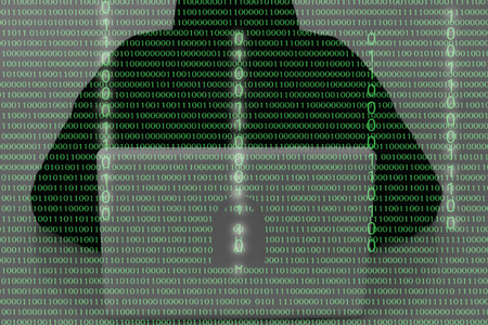 computer hacker wearing a hooded top using laptop in the dark. The man breaks the access to steal information and infect computers and systems. hacking, network security, identity theft and internet crime double exposure with 01 code binary numberの写真素材
