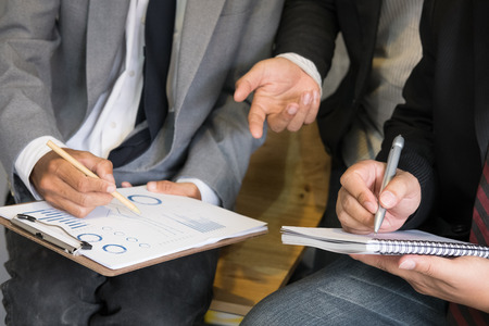 young business people having a meeting in office. businessman and businesswoman working together at workplace. Conference, discussion, teamwork, collaboration, corporate concept.の写真素材