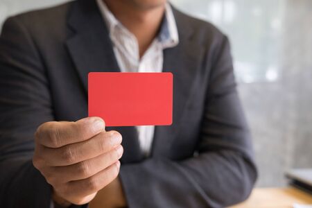 young business man holding a credit card for online shopping, purchase goods from internet, make payment on bank websiteの写真素材