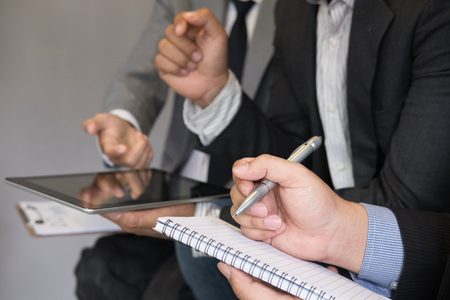 young business people having a meeting in office. businessman and businesswoman working together at workplace. Conference, discussion, teamwork, collaboration, corporate concept.の写真素材