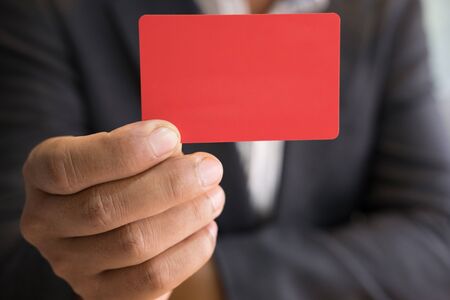 young business man holding a credit card for online shopping, purchase goods from internet, make payment on bank websiteの写真素材