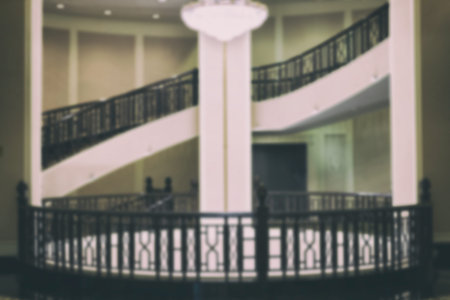 Luxury stairway interior architecture. circular wood classic staircase. blur image for background