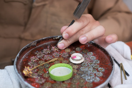 Chiang Mai, Thailand - July 1, 2017: craftsman working with gemstone for making ethnic jewelry at Lanna Expo 2017 in Chiang Mai, Thailand on July 1, 2017.のeditorial素材