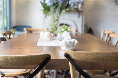 wood table and chair in dining room beside window. modern home interiorの写真素材