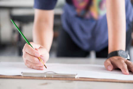 artist painting picture on paper at studio. woman painter holding brush in art workshop. creativity, hobby conceptの写真素材