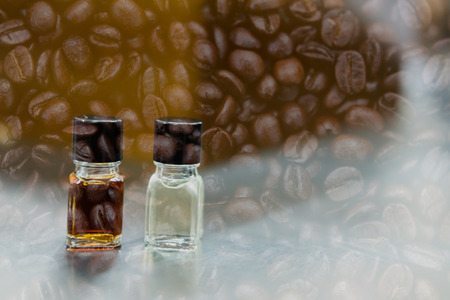 coffee tasting with reference flavor. art of aroma perception in coffee. bottle of fragrance for taster to smell aromatic double exposure with roasted bean.の写真素材