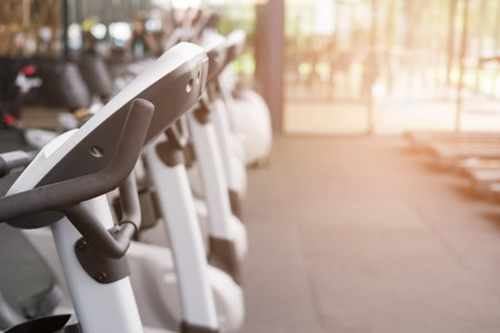 fitness facility center, gym interior, health club with sports training equipment for aerobic...