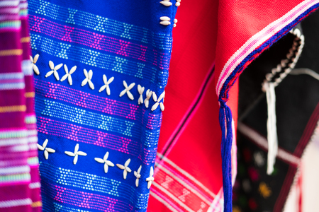 colorful traditional clothes of Karen ethnic hill tribe minority in Thailand for sale in marketの写真素材