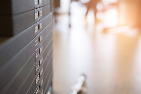 fitness facility center, gym interior, health club with sports training equipment for aerobic exercise workout and bodybuildingの写真素材