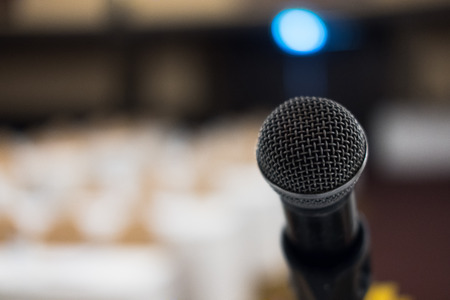 microphone in modern conference hall interior with white chairs. seminar room with empty seat. business event conceptの写真素材