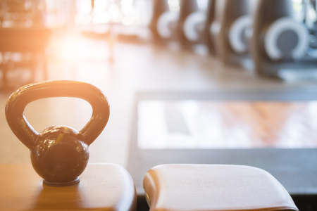 black metal weight in gym. kettlebell in health club. fitness, training, healthy lifestyle conceptの写真素材