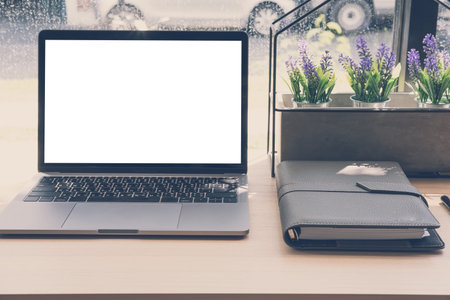computer laptop, notebook on wood desk. laptop at office workplace.
